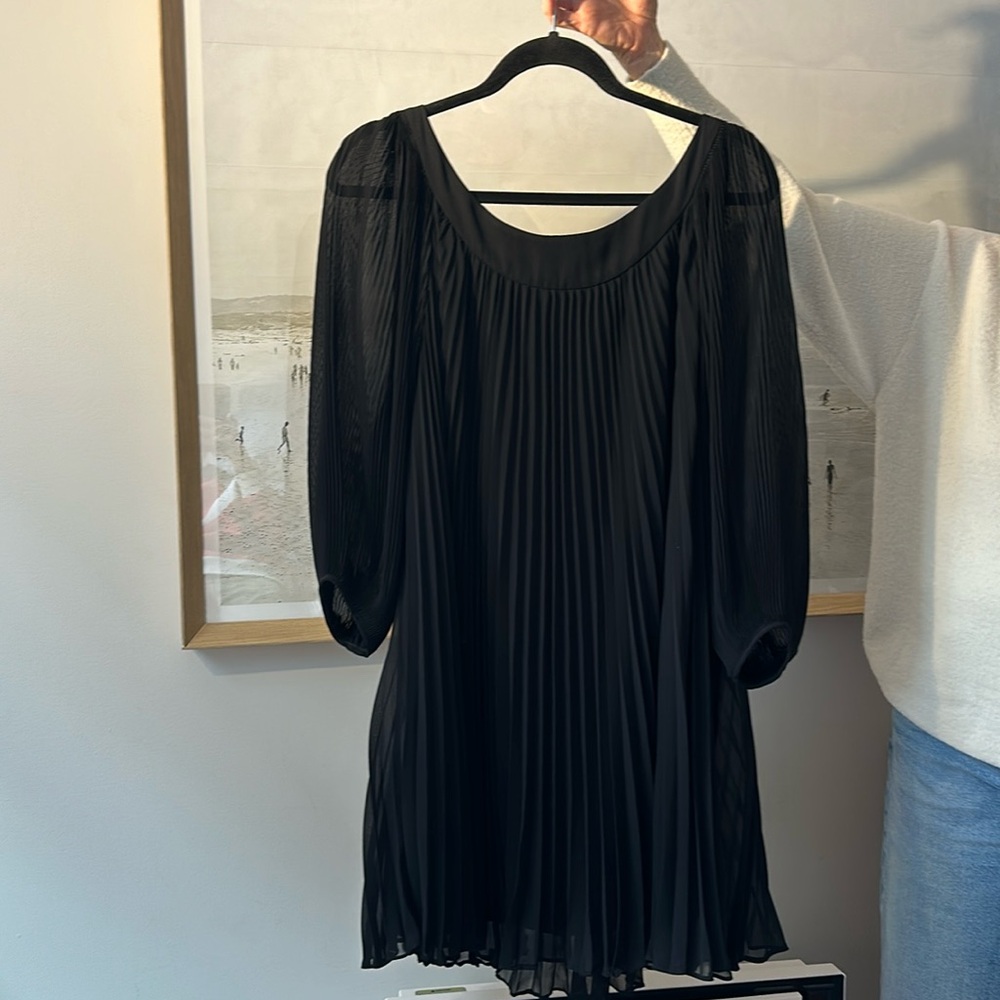Black flowy pleated quarter sleeve mini dress. Size small